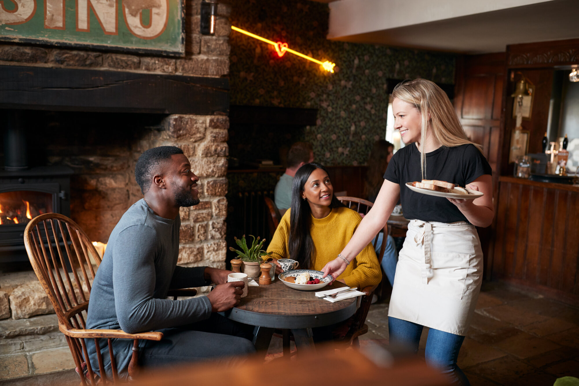 Waitress working in a traditional english pub